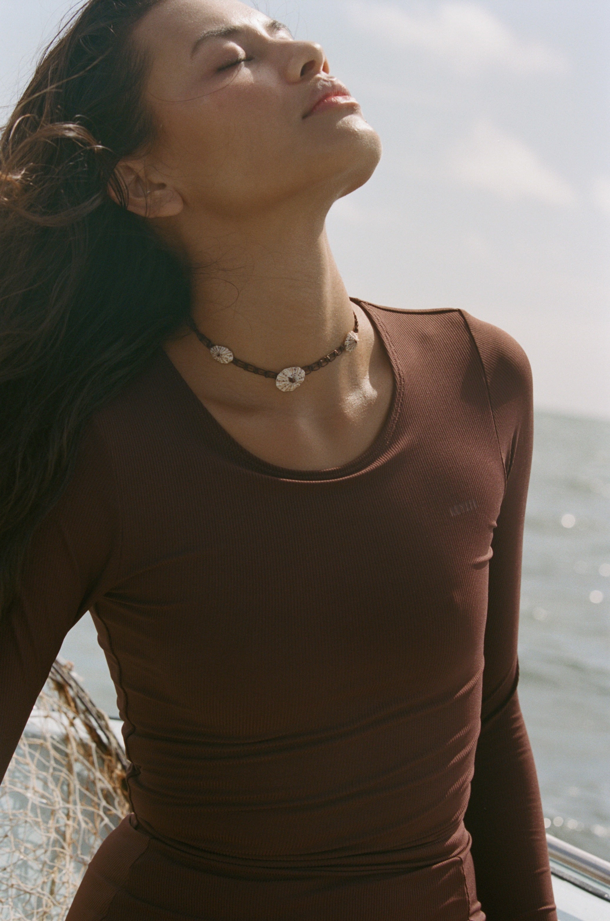 The Poppler is our new long sleeve cropped rash-guard top. A second-skin, full-coverage silhouette that is perfect for roaming the ocean while being protected from the sun.