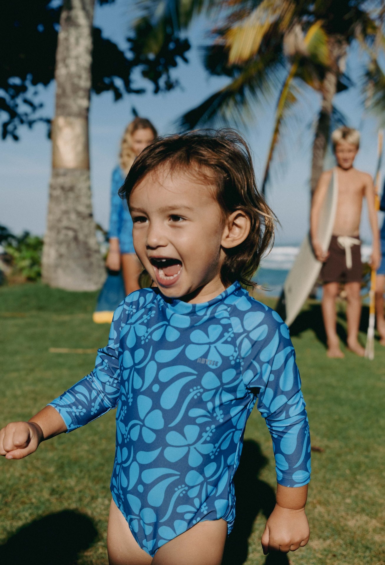 Introducing the Mini Ama Surf suit, a long sleeve one-piece swimwear, made to protect your little ones from the sun during long days at the beach