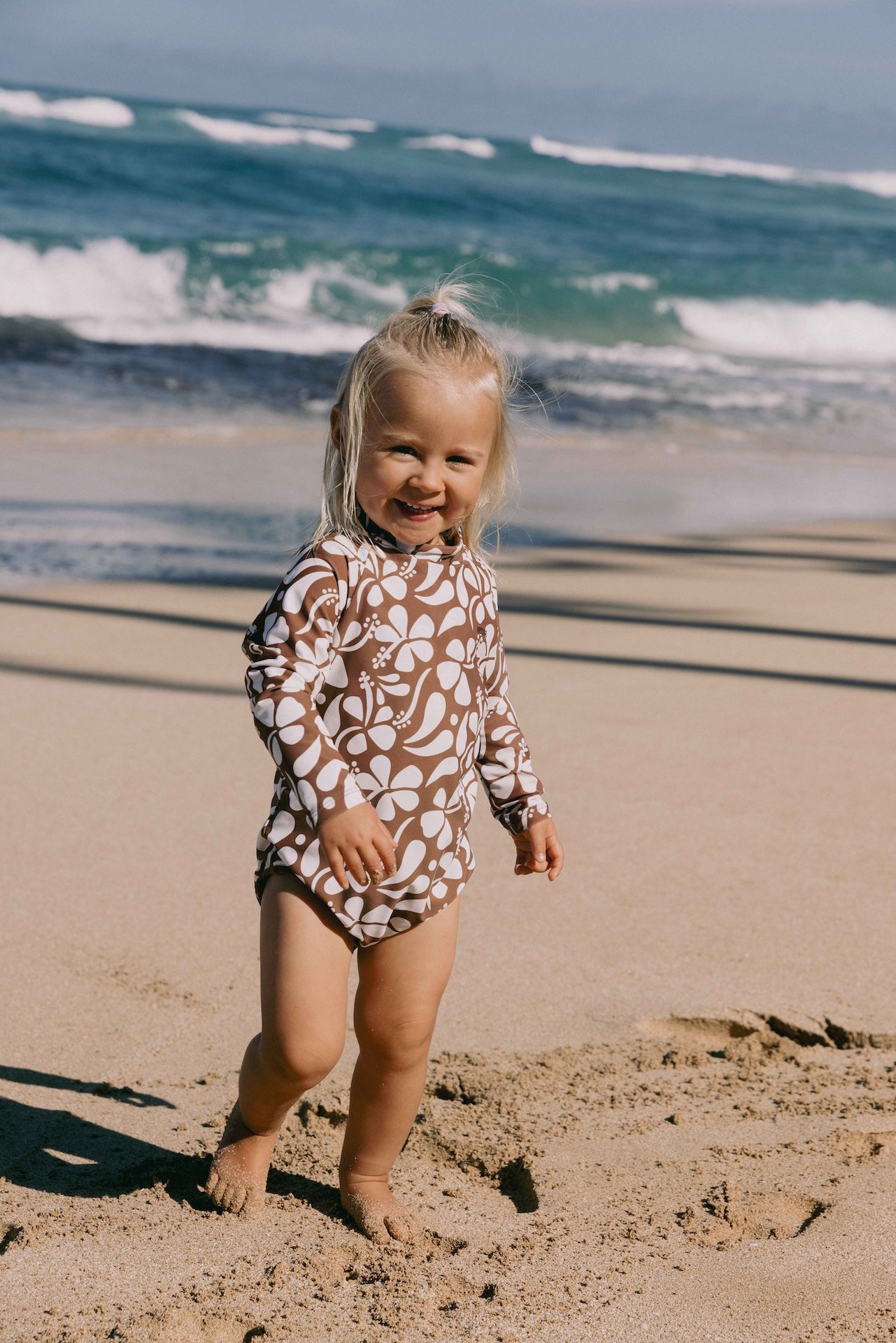 Introducing the Mini Ama Surf suit, a long sleeve one-piece swimwear, made to protect your little ones from the sun during long days at the beach