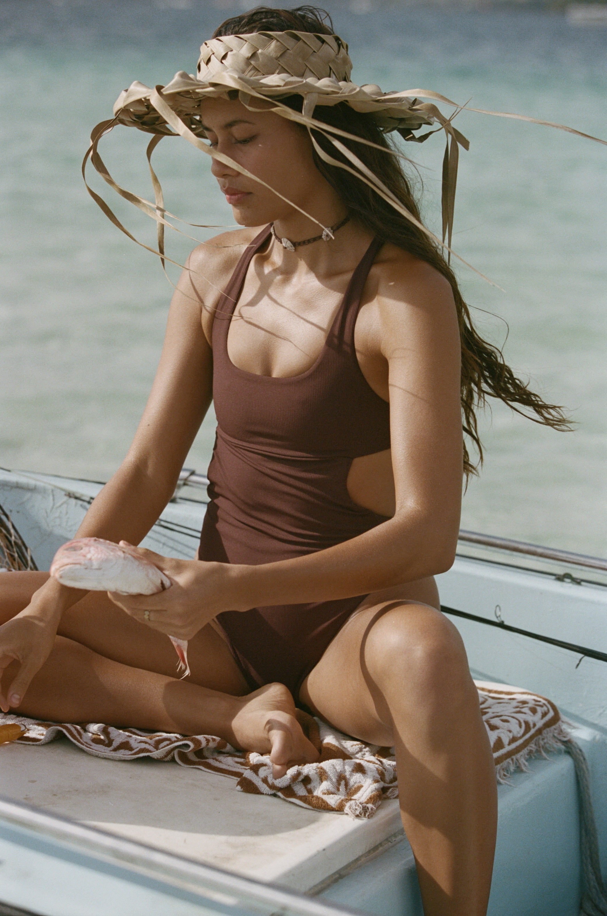 Margo, our sporty one-piece is designed to move. Crafted with a racer open-back and a classic bottom, a supportive bralette and a peekaboo cut outs to enhance your body contour. 