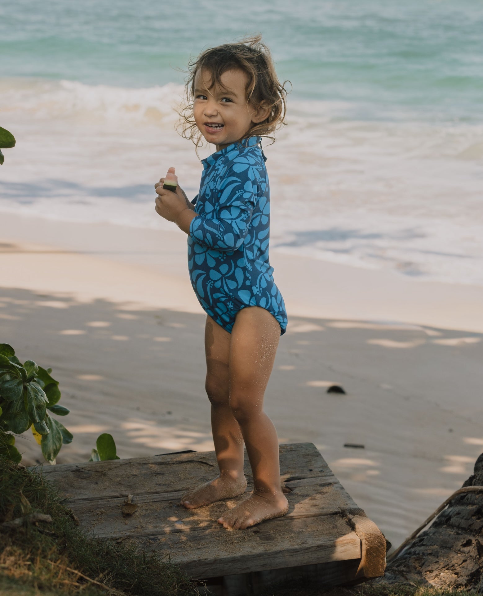 Introducing the Mini Ama Surf suit, a long sleeve one-piece swimwear, made to protect your little ones from the sun during long days at the beach