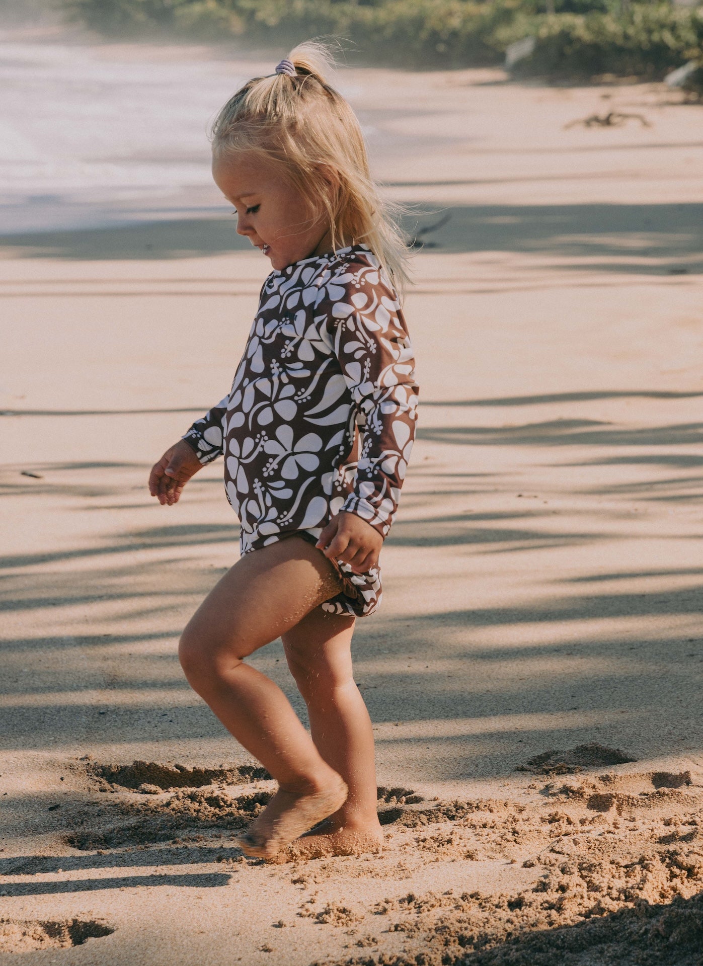 Introducing the Mini Ama Surf suit, a long sleeve one-piece swimwear, made to protect your little ones from the sun during long days at the beach