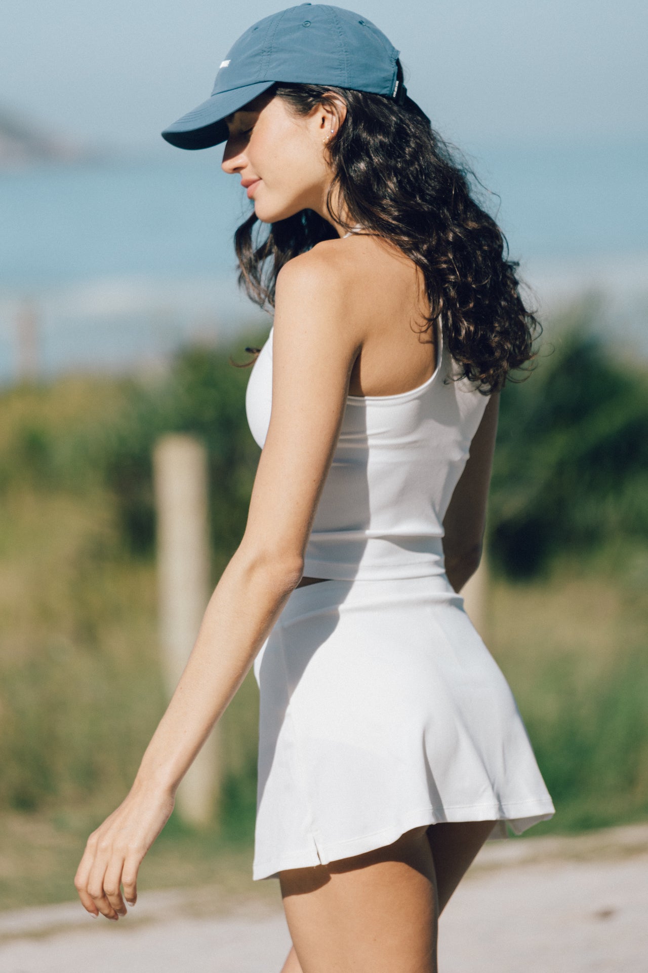 We designed our dream active tank top, here is the Oki. Made with a racer back and integrated shelf bra, this cropped top is meant to give you support while feeling extra soft and cozy.