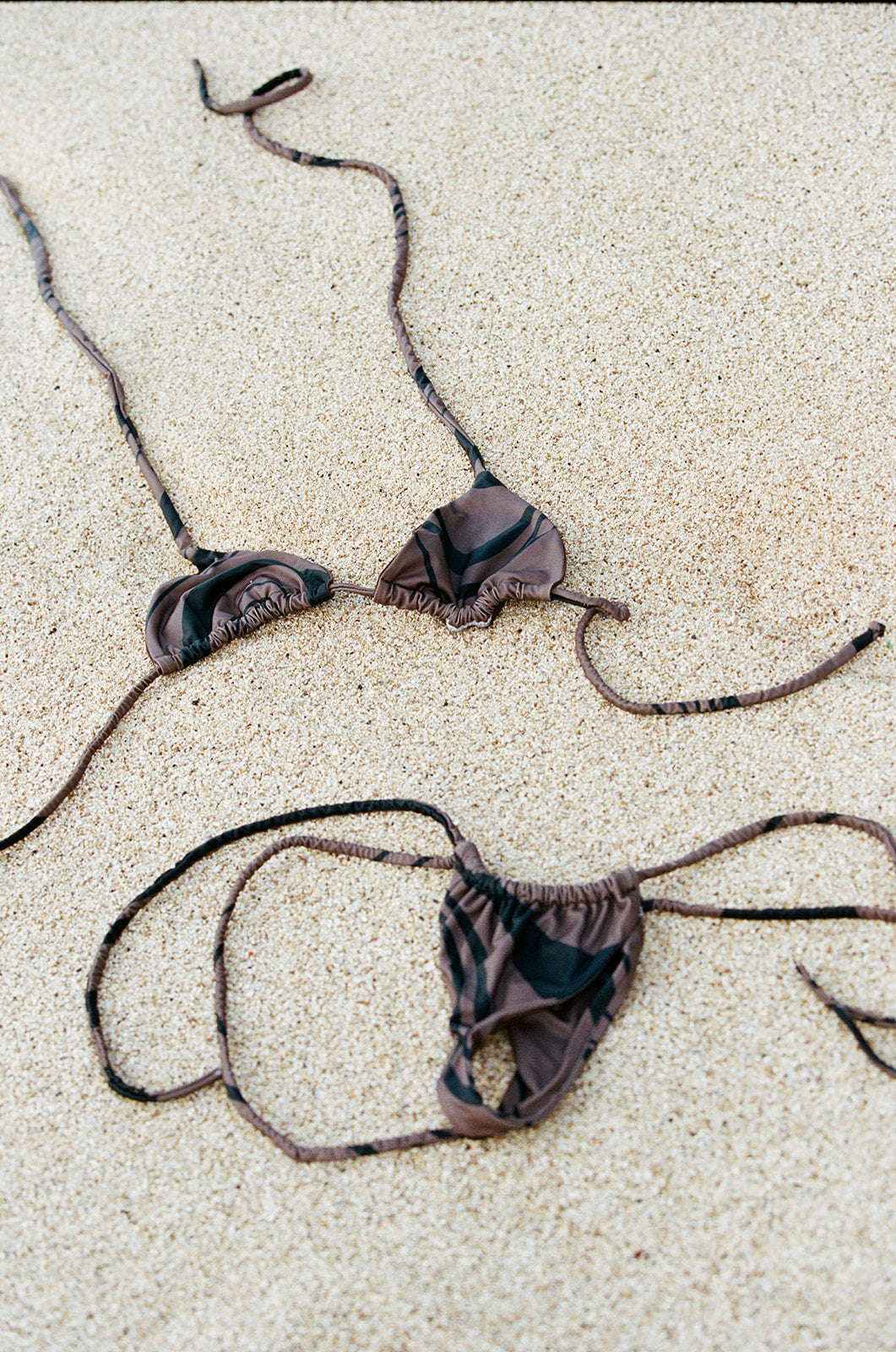 The Maya is a classic triangle top, attached via a neck and back bow tie. The bust cups have a ruched aesthetic look but are also adjustable to your body.